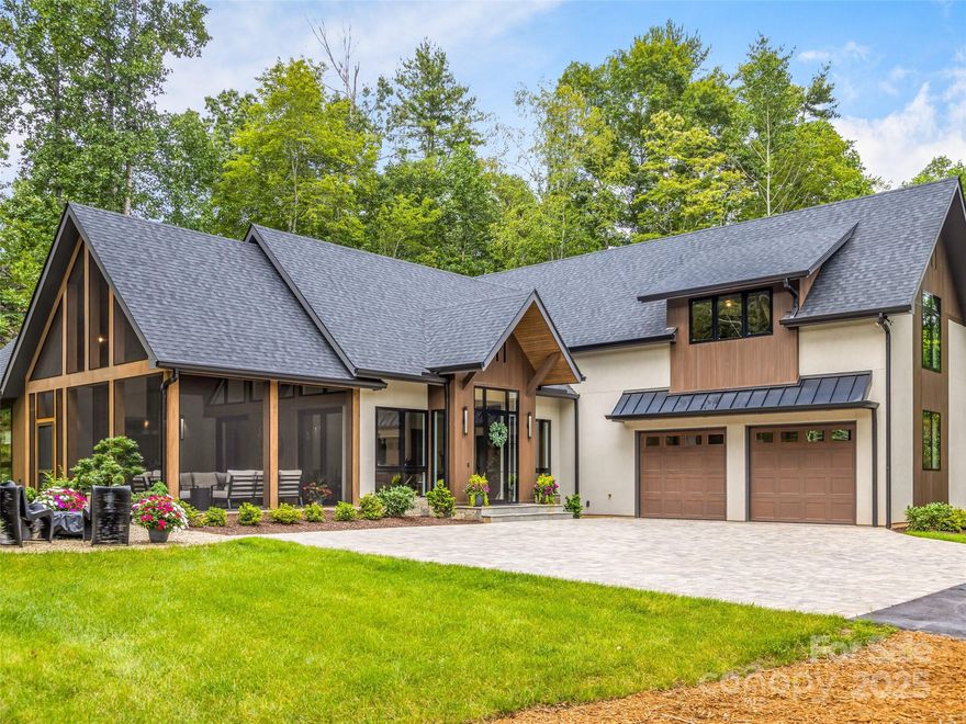 A rare opportunity for almost new construction in the prestigious Champion Hills Country Club on the renowned Tom Fazio golf course! Completed in 2024, this stunning 3,915 sq ft home is the builder's personal residence and showcases the exceptional quality, craftsmanship, and upgrades you'd expect. The dramatic great room features soaring beamed ceilings and two walls of glass, flooding the space with natural light and connecting seamlessly to the outdoors. Pocketing sliders lead to a screened outdoor living area complete with outdoor kitchen, fire pit and putting green. The gourmet kitchen is a chef's dream with Thermador appliances, a coffee bar, and a huge walk-in pantry. The main level includes a luxurious owner's suite, guest bedroom, and large office. Upstairs you'll find two private guest suites and a spacious home gym or game room. Designer furnishing package with original paintings available for $75,000. A true luxury retreat--seller is the builder and listing agent.