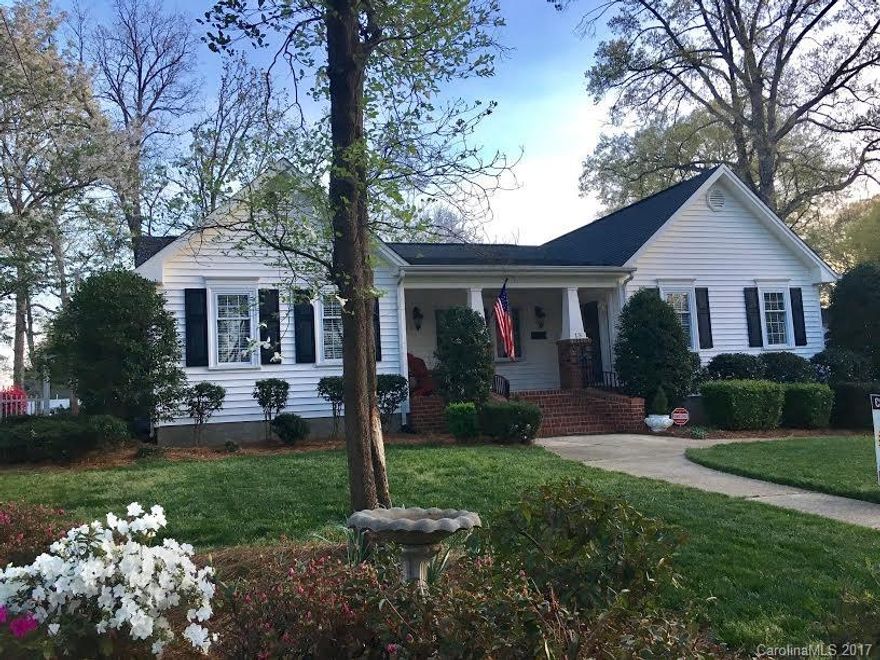 Location! Location! Location!...Walking distance to Downtown Belmont & across street from Davis Park, 3 bedrooms, 2 bath, cape cod style ranch home. Split bedroom, beautiful updated kitchen w island, black granite, white cabinets & stainless, fireplace in both family & dining rms, crown molding throughout, tile & hardwood floors, generous size Trex deck overlooking private fenced-in tranquil backyard. Detached single car garage with finished room attached (200sf, window unit ac, no heat)