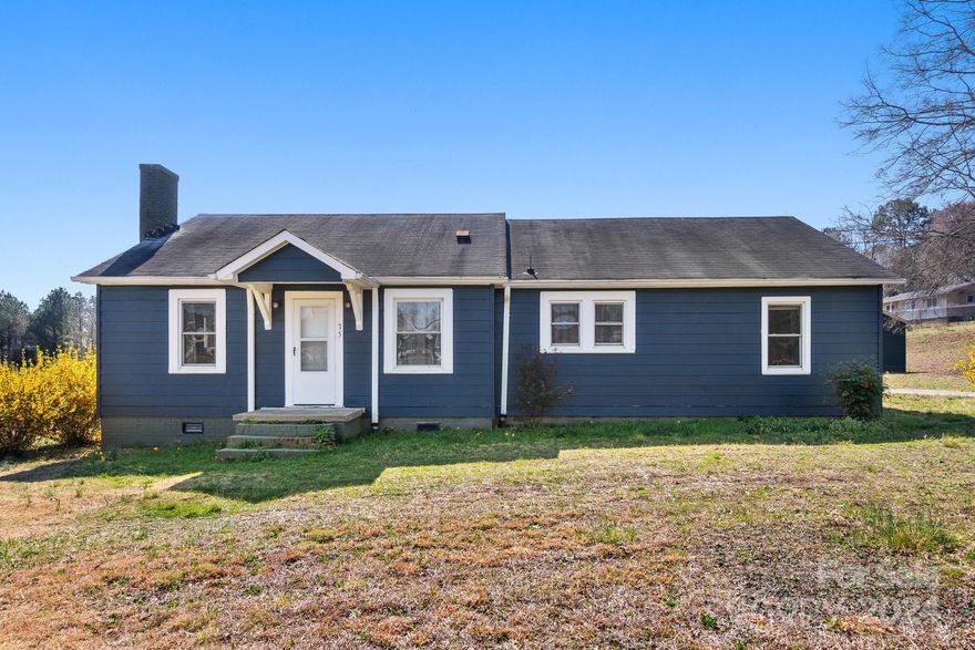 This property is a must see with so much potential! Needs work, but priced to sell! This home is nestled on 2.224 acres and features 2 bedrooms, 1 bathroom, a large kitchen, and a bonus room! The bonus room has been divided into 2 rooms by a wall that can be easily removed. The property also features 2 outbuildings!! One has a detached garage with an attached laundry room and 2 storage areas!! The other outbuilding features 2 large rooms perfect for a workshop, bonus room, and so much more!!! Minutes from the 74 bypass makes it an easy commute.