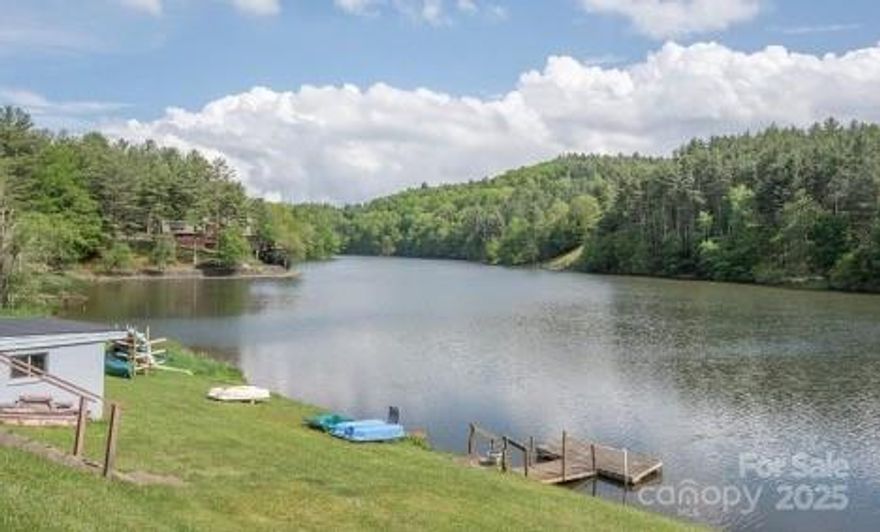 RENOVATED LAKEFRONT CONDO. This condo offers breathtaking lake views and a prime location just minutes from West Jefferson, the New River, and the iconic Blue Ridge Parkway. Step inside this thoughtfully designed main-level unit, featuring an open-concept layout that effortlessly blends the kitchen, dining, and living spaces. A laundry closet and convenient half bath complete the first floor, making daily living a breeze. Upstairs, you’ll find two cozy bedrooms and a shared full bathroom—the perfect setup for full-time living, a relaxing vacation getaway, or a lucrative rental property. Enjoy the perks of lake access, whether it’s paddling out on your kayak or soaking in the serene views. The POA fee covers trash pickup, cable/internet, and water. Includes a paddleboat and kayak for your lake adventures. Peaceful retreat or an income-generating property condo offers endless possibilities.