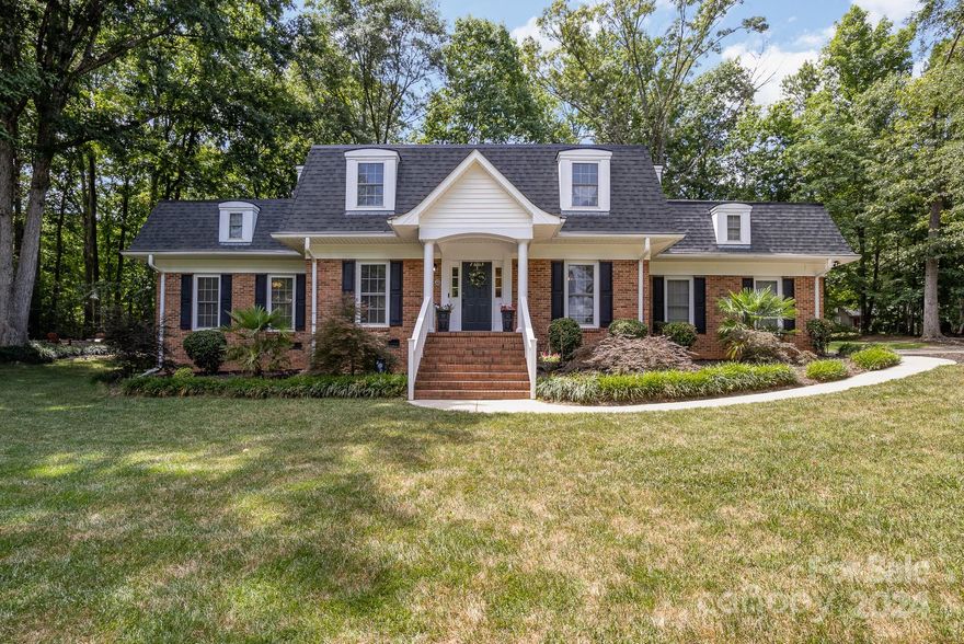 Welcome to your dream home! This exquisite 5-bedroom, 3-full-bathroom residence is nestled on a beautifully landscaped 3/4 acre lot in the desirable Rock Hill area. Featuring a spacious primary suite on the main floor with an updated en-suite bathroom, this home is designed for luxurious living and convenience. Step into the heart of the home – a fully updated kitchen, perfect for culinary adventures and family gatherings. The private backyard is a true oasis, offering ample space for outdoor activities and relaxation. Whether hosting a summer barbecue or playing catch, this yard is sure to be a favorite spot for family and friends. This home is walking distance to the swim/tennis club, providing excellent recreational opportunities just steps away. Plus, enjoy the ease of being just minutes from shopping, dining, the hospital, and I-77, making commuting and errands a breeze. Don't miss this opportunity to own a stunning home in one of Rock Hill's most sought-after neighborhoods.