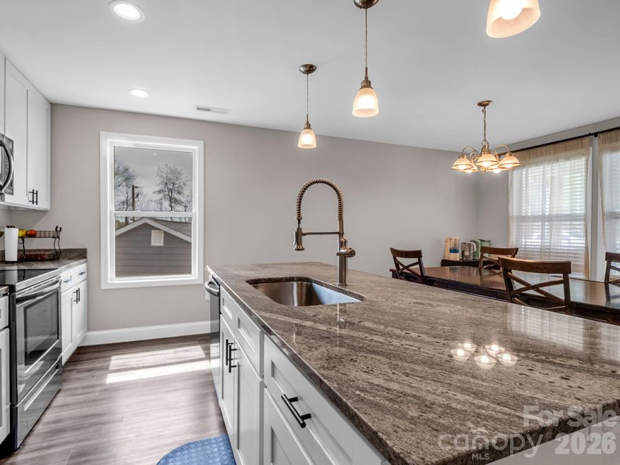 Clean lines, great light, and effortless one-level living come together in this thoughtfully designed home in one of West Asheville’s most sought-after areas. The interior offers a contemporary feel with an open layout that makes everyday living and entertaining feel natural and connected. The kitchen stands out with quality finishes, stylish cabinetry, solid surface countertops, a functional bar seating area, and sleek upgraded appliances that give the space a polished look. The primary suite provides a comfortable retreat with a well-appointed private bath featuring double vanities and a beautifully finished tile shower. Additional highlights include abundant natural light throughout and smart use of space.A rare bonus is the exceptionally tall crawlspace, offering valuable storage potential rarely found in homes like this. A great opportunity for buyers looking for modern comfort, smart design, and a prime West Asheville location. Located only 10 minutes from Downtown Asheville and 5 minutes from Haywood rd.