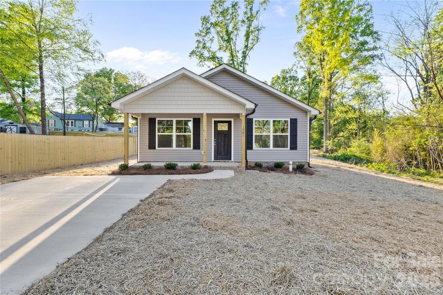 Charming 1,232 sq ft home minutes from Downtown Kannapolis — ideal blend of convenience and comfort. This well-built residence features 3 bedrooms and 2 full baths, an open living/dining area with abundant natural light, and a functional kitchen with ample cabinet space. Luxury vinyl flooring flow through the main living spaces; the primary bedroom includes a private bath. Outside, a patio and a low maintenance quiet backyard. Located close to restaurants, breweries, parks, the NC Research Campus, I-85 and commuter routes, plus nearby schools and shopping — enjoy small-town charm with big-city access. Perfect for first-time buyers, downsizers, or investors. Contact for a showing or more details.