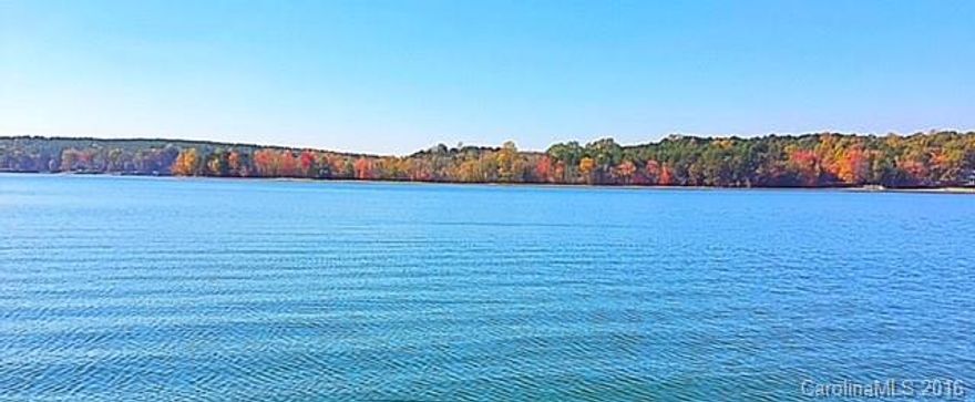 WATERFRONT BUNGALOW WITH AMAZING PANORAMIC VIEWS of Lake Norman! Private location tucked away off Slanting Bridge Rd.  Very unique rental with 1 bedroom, 1.5 baths, full kitchen and living room. Washer, dryer, stove & refrigerator included. Great opportunity for someone not needing a large space. Enjoy the beach! Furnished as is or unfurnished.