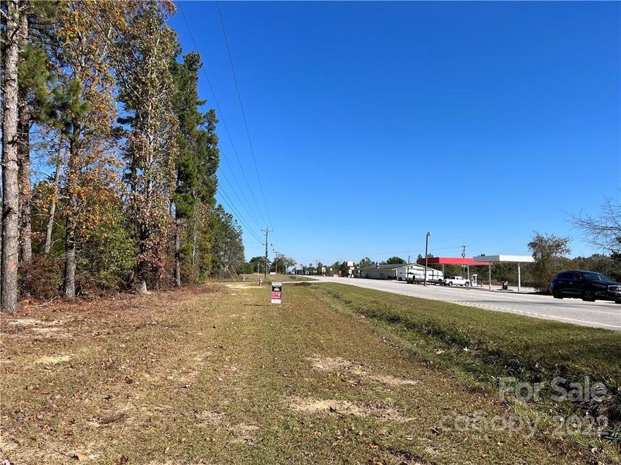 Wonderful and hard to find 8.37 acres lot on the corner of highway 903 Flat Creek Highway, Kennington Rd and the intersection of 601.  This parcel has natural gas line and water line along the road.  Cost to connect to city water is $2,400.    The parcel is zoned AR by Lancaster and it has already been subdivided into 2 lots.  Lot #7 and Lot # 8.  See plat map in attachments.  It can't be subdivided any further.  It's zoned for agricultural and residential.  It allows for site built, mobil home, modular home and barndominium.  Trees are a mix of hardwoods and pines.  Located 3 miles from Haile Gold Mine and 6 miles from Kershaw.  This is definitely a must see lot and easy to walk it.  Please call listing agent with any questions.  Buyer's agent to investigate anything important to buyer.