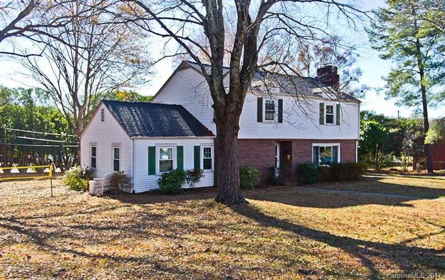 Traditional 2-story, brick & vinyl home with 2-car detached garage & unfinished basement for extra storage. Main level features formal living room, dining room, large eat-in kitchen, office, den & main level bedroom & bath. Second level has 3 large bedrooms & full bath. Main entry has charming curved staircase. Additional features: hardwood floors & fireplace in living room.