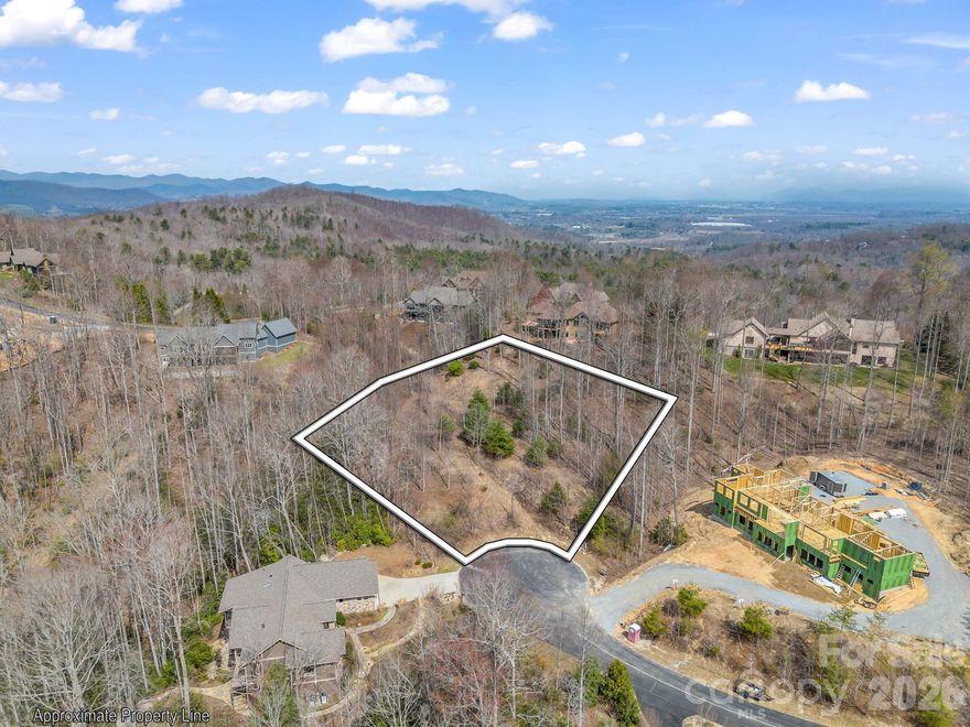 Discover the perfect setting for your dream home on this exceptional acre homesite with stunning southern-facing, long-range mountain views, ideally positioned on a quiet private cul-de-sac in the prestigious gated community of Cummings Cove.

This easy-build lot is ready to go, featuring a plat and topo survey, $5,000 prepaid private sewer connection, and access to city water, natural gas, and underground utilities—saving you time and money. The gentle terrain and ideal sun exposure make it perfect for a ranch or multi-level home, with plenty of space for outdoor living and gardening.

Cummings Cove is nationally recognized as one of the Top 50 Master-Planned Communities in the U.S. by Where to Retire Magazine and offers an unmatched mountain lifestyle. Enjoy a championship 18-hole golf course, clubhouse, outdoor pool and hot tub, fitness center, tennis and pickleball courts, bocce, dog park, community garden, scenic ponds, on-site dining, and a full calendar of social activities. Not age-restricted.

Conveniently located just 15 minutes to Hendersonville, Asheville, and Brevard, and minutes to grocery shopping, hospitals, the Ecusta Trail, and the French Broad River.

Social membership is only $60/month.

Rare combination of views, privacy, and ready-to-build convenience—come walk this beautiful property and experience it for yourself.