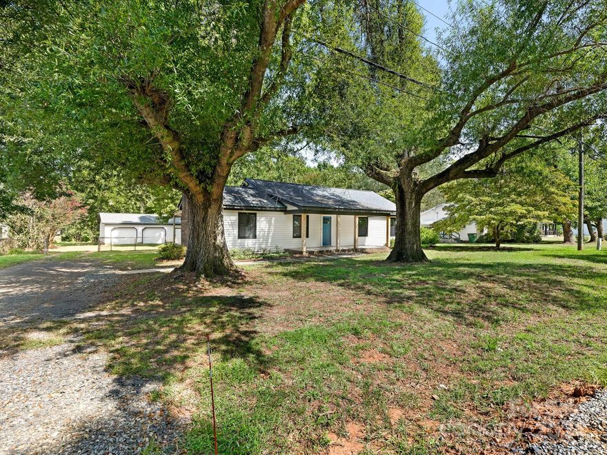 The word that comes to mind to describe this home is HOMESTEAD. The last owner lived and raised their family here for over 50 years. Now after significant upgrades to the home (new roof, new hvac, new windows, new lighting and plumbing fixtures, new flooring, new granite, new appliances, etc), the essence of this homestead are tastefully carried forward for your enjoyment.
The large den with wood burning fireplace and huge kitchen are definitely the indoor focal points of the house.  Outdoors there are a multitude of places and things to enjoy -  rear deck, large shaded patio, fenced in yard, a 2 car garage, shed, and additional land behind the garages for gardens, storage, etc. 
If you like gardening, you'll love the 3 mature blueberry bushes and the native mulberry trees, along with old time plants such as a carolina allspice bush and a fringe tree. 
Come, sit and enjoy the shade and take in the beautiful fragrances surrounding you as you make this home  your families’ HOMESTEAD.