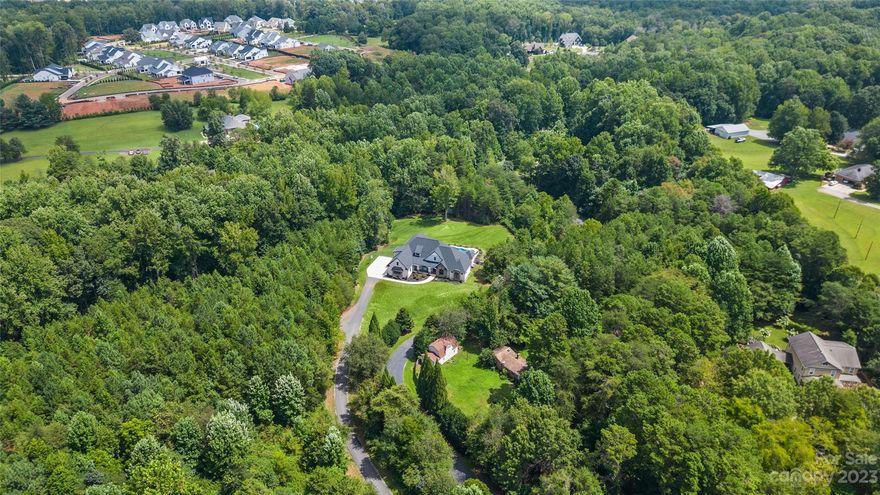 Back on MARKET - No Fault of the Sellers! House has APPRAISED! ARCHITECTURALLY WELL DESIGNED CUSTOM HOME -MANY FEATURES WELL and SITUATED 2.371 ACRES NOT IN A NEIGHBORHOOD WITH NO HOA FEES OR RULES …..This property will not last long - Better Hurry!  Great Rm with built-ins & FP/Wood floors/Large Kit has farmhouse sink, island, wet bar & Walk-in Pantry overlooking Custom doors that open to Screen Porch, Brick tiled floor, FP & access to Covered Back Porch + view of Salt Water Pool! Hard to find one level home that has 4 Bedrooms, 3 1/2 baths PLUS Upstairs boosting additional 5th Bedroom-Bonus, Full bath, Rec Rm/Walk-in Attic/Laundry Rm has cabinetry/HUGE 3-Car Garage finished / Tankless H20 Heater /Well Over 4,000 heated living area + covered front & rear porches, Screen Porch & FP / Great Schools - Hough High, Bailey Middle & Huntersville Elementary / You will NOT find a Like-New Custom Home with no neighborhood setting & No HOA Fees + Over 2 Acres of land this close to the Queen City