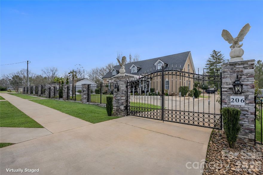 Hidden luxury awaits. Built in 2020, this stunning two-story custom home features 10-foot ceilings on main level, ceramic tile flooring, tray ceilings, and recessed lighting throughout. A striking, internationally custom-ordered front door welcomes you into a receiving den with a cozy marble fireplace, flowing seamlessly into the open and spacious living room, perfect for entertaining.
The gourmet kitchen boasts stainless steel appliances and a show-stopping island with a waterfall marble countertop. The primary suite is a true retreat, featuring tray ceilings and a spa-inspired bathroom with ceramic tile walls, double vanity, stand-up shower, and garden tub. Upstairs, you’ll find 9-foot ceilings, a spacious family room ideal for a home theater, gym, or entertainment area, along with an additional bedroom, bonus room perfect for an office or guest room, and a full bathroom.
Step outside through elegant French doors to a large covered rear porch and paved patio with a brick fireplace, overlooking beautifully landscaped grounds accented with palm trees. Follow the paved walkway to a firepit area with built-in swing chairs, creating a serene outdoor oasis. The property also includes a 12x30 she-shed with a covered front porch, ideal for an office, gym, or creative space, as well as an impressive 30x60 workshop with 12-foot ceilings, two half baths, and a second-level floor, currently used as a workshop and party area.
Conveniently located near Hwy 29 and I-85, and just 10 minutes from shopping, groceries, and entertainment, this one-of-a-kind property offers luxury living with unmatched versatility.