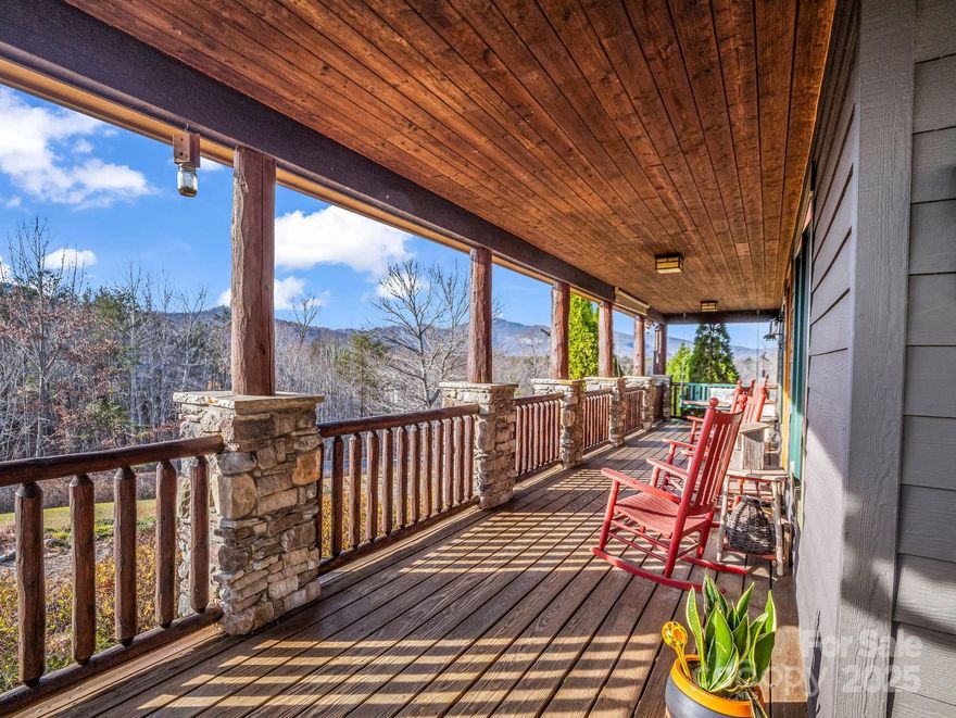 Take your pick! Morning coffee with the mountains, dinner at sunset, curled up among the trees with a book, or scrolling social media on the deck pretending to be productive—your call! No judgement! :)
Sitting amazingly perfect on 4.28± ACRES!

Welcome to 301 Peaks Drive—beautifully crafted, MOVE-IN READY mountain cabin perched in The Peaks of Lake Lure, one of the area’s most sought-after gated communities with it's ease of access and killer views!!! Known for its serenity, paved roads, gentle access (no steep mountain climbs here!), and long-range Blue Ridge VIEWS, this is a top pick for anyone wanting the perfect blend of privacy, beauty, and convenience. 

AMAZING MOUNTAIN VIEWS - This home makes you stop and say, “Wow,” each time you walk through the door as sunlight pours in the windows and an inviting floor plan with vaulted ceilings, warm wood accents, and expansive windows framing those year-round ridgelines like moving artwork! The cozy stone fireplace centers the living room, while the kitchen and dining flow right out to the expansive deck, also! Comes with 2 - one car garages - 1 for each "living area" - car enthusiasts or for a second living quarters, it can be offered or finished out... your choice!! 

Another huge perk - The separate 2nd living quarters, complete with its own private entrance and its own garage/parking area. Perfect for guests, multigenerational living, or an income-producing rental, this setup offers incredible flexibility. It has its own easy pull-up access. (***Previously rented out prior to these owners)

Outside, enjoy wooded privacy, room to explore, and a quiet yet babbling creek at times along the lower property line. You might never make it down that far, though—because the front porch and decks offer such extraordinary, peaceful vistas that you’ll feel completely wrapped in the mountain backdrop, soaking in unobstructed views. Come see for yourself! 
(*Appointment required—gated community; must be accompanied by an agent.)

Whether you're searching for a full-time home, a mountain getaway, or a smart investment, 301 Peaks Drive delivers unbeatable Mountain Views, natural light, thoughtful design/layout + 2nd Living Quarters, and one of the best locations Lake Lure has to offer - for your quick access or private seclusion! See what the fuss is all about! 

Also, surrounded by Western North Carolina’s incredible outdoor recreation, you’re just moments from Chimney Rock State Park, Lake Lure, and year-round adventures if you decide to venture out! Travel is easy too, when you come in or have family/friends visiting —about 1 hour to AVL and GSP airports, and roughly 1.5–2 hours to the Charlotte area (CLT International) Homes here don't last long, and thanks to the combo of quiet living, gorgeous scenery, and being only minutes to shopping, dining, and Lake Lure’s best attractions, along with all this home offers...