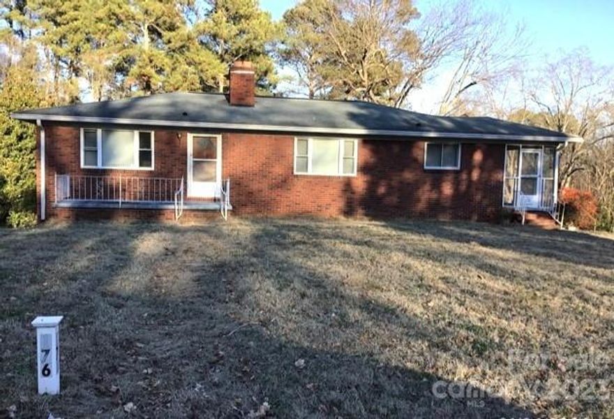 Nestled on just outside of Historic Downtown Concord, this beautifully improved brick ranch is a hidden gem! With over 2 acres and a prime location close to the local park, this home effortlessly blends historic elegance with natural beauty. Home features beautiful wood floors, spacious living room and dining area, and screened side porch. The full basement provides lots of space for your workspace, office, recreation or a storage.  The backyard is huge with a patio and the basement garage entrance. Enjoy the Screened side porch with your favorite beverage or create an entertaining space in the back yard. This ideal retreat offers the best of both worlds: a peaceful escape in a parkside setting, yet close to all conveniences. Truly a haven for those seeking beauty, comfort, and serenity!