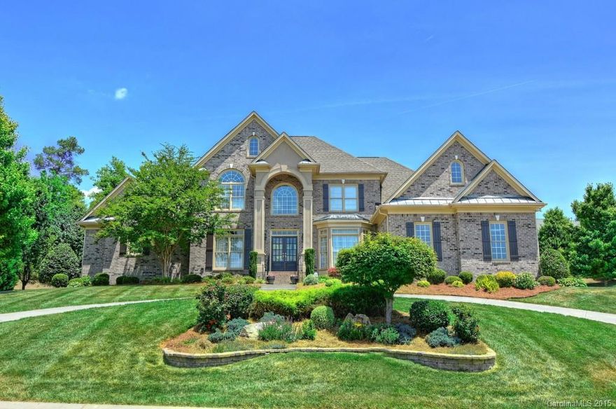 Gourmet kitchen w/ maple cabinets, glass backsplash, granite c'tops,  island, SS appliances. Formal dining room, formal living room or office w/ French doors, Two story family room w/fireplace and built-ins. Master on main with office attached. Spa tiled bath w/ jetted tub , separate vanities.  Three bedrooms with three adjoining bathrooms., huge rec room, with adjoining media room. Awesome outdoor living area w/fireplace, pergola, patio, brick accent wall,  Corner lot, Tons of Storage.