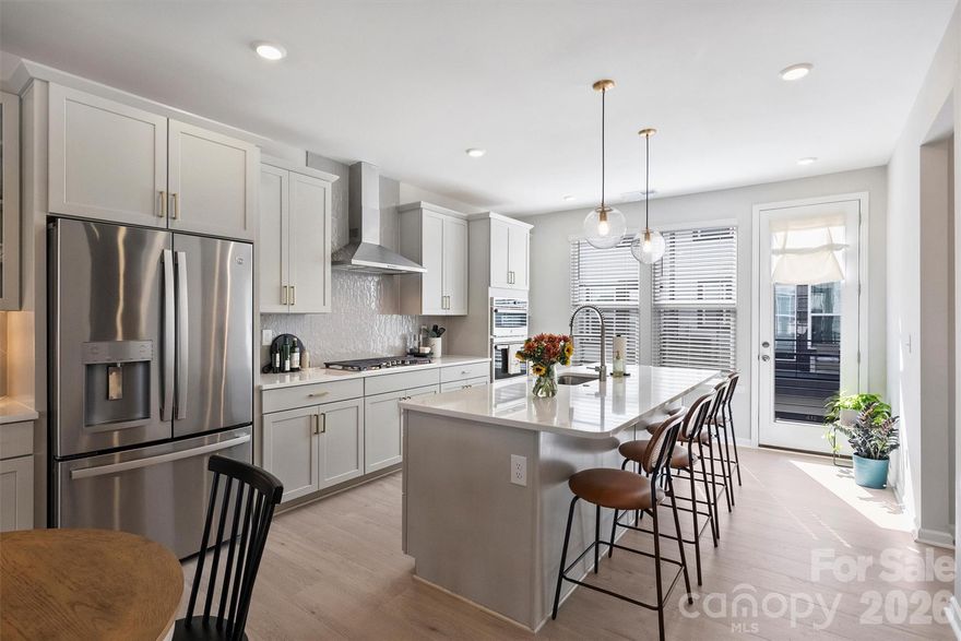 Experience refined living in this 2024-built townhome perfectly positioned to enjoy the best of Davidson’s vibrant lifestyle. Just steps from shops, restaurants, grocery stores, and the charm of Davidson’s community events, this home blends modern convenience with small-town appeal.
Offering a four-bedroom, 3.5-bathroom layout, this residence features an open-concept design highlighted by a gourmet kitchen with a gas cooktop, stainless steel exhaust hood, serving area, and a double-sided pantry for exceptional storage. Elegant finishes continue throughout with wood stair treads, quartz countertops, and an inviting balcony off the main living area, perfect for morning coffee or evening relaxation.
The spacious primary suite boasts a large walk-in closet and an extended walk-in shower for a spa-like retreat. A two-car attached garage adds convenience, while the low-maintenance lifestyle allows you to focus on enjoying all that Davidson has to offer—walks to the Farmers Market, dining/shopping on Main Street, and community gatherings, and live music series, just beyond your doorstep.