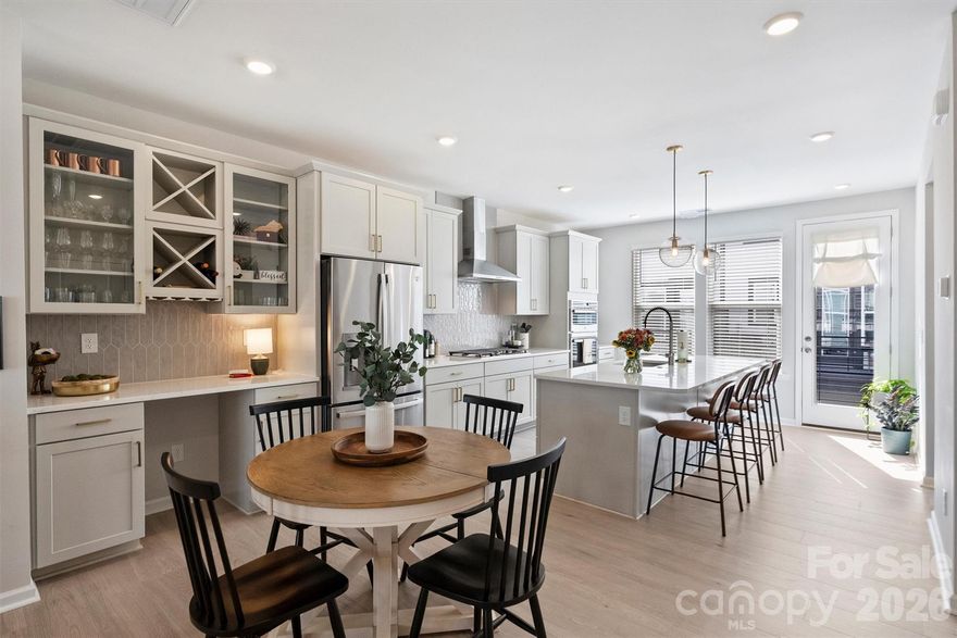 Experience refined living in this 2024-built townhome perfectly positioned to enjoy the best of Davidson’s vibrant lifestyle. Just steps from shops, restaurants, grocery stores, and the charm of Davidson’s community events, this home blends modern convenience with small-town appeal.
Offering a four-bedroom, 3.5-bathroom layout, this residence features an open-concept design highlighted by a gourmet kitchen with a gas cooktop, stainless steel exhaust hood, serving area, and a double-sided pantry for exceptional storage. Elegant finishes continue throughout with wood stair treads, quartz countertops, and an inviting balcony off the main living area, perfect for morning coffee or evening relaxation.
The spacious primary suite boasts a large walk-in closet and an extended walk-in shower for a spa-like retreat. A two-car attached garage adds convenience, while the low-maintenance lifestyle allows you to focus on enjoying all that Davidson has to offer—walks to the Farmers Market, dining/shopping on Main Street, and community gatherings, and live music series, just beyond your doorstep.