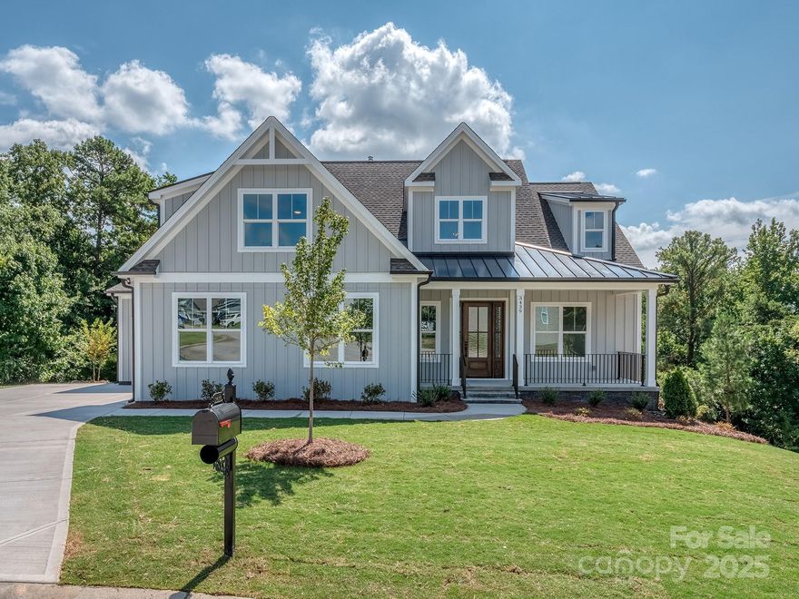 This beautiful new cul-de-sac home is constructed on one of the few remaining custom lots in the established lake front community, Handsmill on Lake Wylie. The home features a primary on main, the spectacular kitchen opens to a dining and great room with fireplace, large laundry room, walk-in pantry and a covered deck with seasonal views of Lake Wylie. The second-floor features two bedrooms, two baths and a large bonus room. The basement is perfect for very comfortable multi-generational living, featuring a full in-law suite, second kitchen, dining, powder room, large living room, and a storage room with laundry. Handsmill is one of Lake Wylie's premier gated communities, featuring a quiet atmosphere, a community pool, clubhouse, fitness & recreation areas, walking trails, boat storage & slips for lease. Also, just minutes from top rated Clover schools, restaurants, and shopping. The home is complete and ready to move in now!