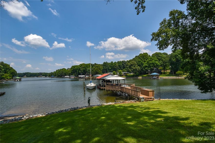 The wait is over! Waterfront home off the highly sought after Brawley Peninsula. 137' of shoreline with brand new rip rap added in 2023. Gentle sloping lot down to the deep year round water in a quiet cove. Dock and back porch have Evergreen (similar to Trek) decking giving you limitless options for dining and entertaining while enjoying the stunning views 365 days a year. This 3 bedroom, 3 full bath and 1 half bath home sits on just under .74 acres BUT has a septic permit approved for a 4 bedroom 4.5 bath home allowing for flexibility should you be looking to make some modifications. This property is stunning - come see for yourself!