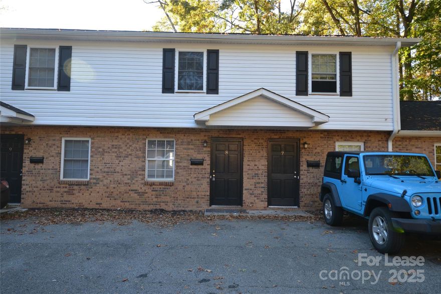 GREAT LOCATION in Stanley, NC. Don't miss out on this Cute townhome. Main level host open family room with Vinyl Plank Flooring and eat in kitchen with black refrigerator. Main level has Powder Room. Upstairs has two bedrooms and a full bath in the hallway with carpet. Rear patio for afternoon lounging. Unit has new HVAC system. Convenient to grocery stores, shopping and restaurants. Complex has a community card operated Laundry Facility on site. $30 per month Pet rent and $10 per month exterior pest fee per month in addition to monthly rent rate