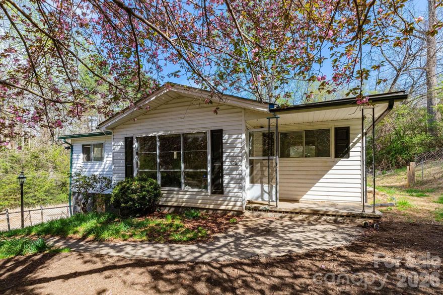 Unlock a rare high-yield investment opportunity in the sought-after Enka area of Asheville. Situated on 2.06 acres, this versatile property includes a single-family home plus five mobile home lots—three with existing homes included—offering multiple income streams and significant upside potential.

Based on previous and current market rent projections, the property has the potential to generate approximately $85,200 annually in its current state, with estimated expenses of ~$11,470/year, resulting in a projected NOI of nearly $74,000. 

Value-add opportunities include increasing below-market rents, filling two vacant mobile home pads, and leasing the garage/shop for additional income. Light improvements such as paint, flooring, and system updates could further enhance rental performance and overall value.

Conveniently located just 5 minutes to Brevard Road and Asheville Outlets, 10 minutes to North Carolina Arboretum and Blue Ridge Parkway access, and 15 minutes to Downtown Asheville, this property offers strong rental demand drivers and long-term growth potential.

Main home does not currently have a functioning heat source. A compelling opportunity for investors seeking to create value and build cash flow in one of Asheville’s most accessible and desirable areas.