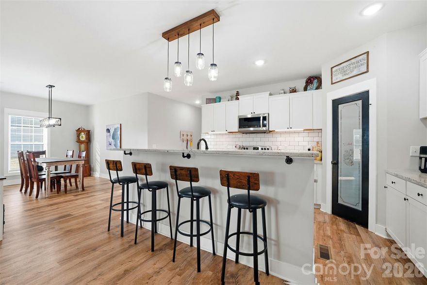 Step into modern farmhouse living in this beautifully crafted four-bedroom, three-bath home built in 2022, where thoughtful design meets everyday functionality. From the moment you arrive, the inviting farmhouse-style exterior sets the tone for the comfort and versatility found throughout the home.

Inside, you’ll find a spacious and well-planned layout ideal for both daily living and entertaining. The home features an attached two-car garage and two separate laundry areas—one conveniently located in the hallway and another privately situated in the primary bathroom—making household tasks effortless and efficient.

The primary suite offers a peaceful retreat with its own en-suite bath and dedicated laundry, while the additional bedrooms provide ample space for family, guests, or a home office. Upstairs, two flexible rooms add exceptional versatility to the home; one is currently being used as an additional bedroom, but both spaces can easily serve as a playroom, media room, office, or workout area.

Built with efficiency and future needs in mind, the home includes two 50-gallon water heaters and two 200-amp electrical panels, offering comfort, reliability, and capacity for today’s modern lifestyle.

Step outside to enjoy a 75 x 100 fenced backyard, perfect for pets, play, gardening, or outdoor entertaining. Whether hosting gatherings or enjoying a quiet evening, this outdoor space offers privacy and room to relax.

With its modern construction, flexible living spaces, and farmhouse charm, this home is move-in ready and designed to adapt to your lifestyle for years to come. Don’t miss the opportunity to make this exceptional property your own.