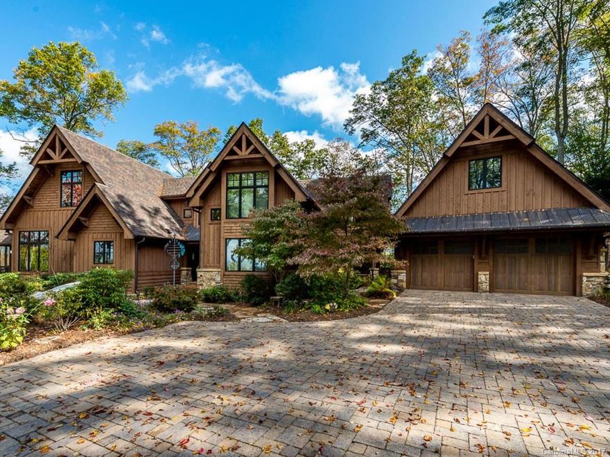 This custom-built, timberframe mountain home features 180 degree long range mountain views year round. Additional square footage consists of the detached two-car garage and the above attic storage area that has plumbing and electrical stub outs for a playroom or guest room conversion. Balsam Mountain Preserve is a 4,400 acre club community with 3,400 acres of conservation land and completed amenities.
