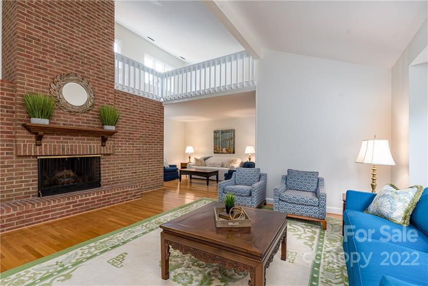 Open the courtyard gates to a beautiful and serene garden area.  This spacious townhome has new carpet and fresh paint!  Enjoy the outdoor living space - front porch, side deck and a back covered porch.  The great room is two stories with a wood burning fireplace that spans all the way up! Also, a second sitting area off of the great room with a built in bar area. The primary is on the main level with a walk in closet and custom shelving.  The primary bathroom has 2 water closets, one with a shower and one with a tub!  Upstairs, 2 very large BR's and 2 BA's.  There is a loft that overlooks the great room.   2 car garage!  Enjoy the privacy that this townhome has to offer!  HOA covers everything outside of the gates, water, roofs and painting.  This section will be painted soon and they are going with a lighter tan. Some sections are already painted the new color. Painting and wood repair will start the end of February. Great south Charlotte location, minutes from Southpark.