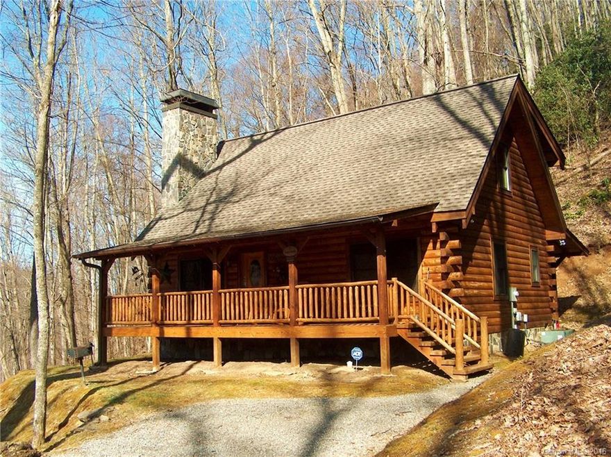 Come relax on the covered front porch, soak in the large hot tub or snuggle up in front of the gas log fireplace in this immaculate home located in a Maggie Valley log home community! This well maintained 2 bedroom, 2 bath home with loft offers a great room with cathedral ceilings and opens to a nice kitchen with beautiful cabinets, tile floors and like new appliances. Easy paved access and close to recreational activities/shopping. Make this your mountain getaway!