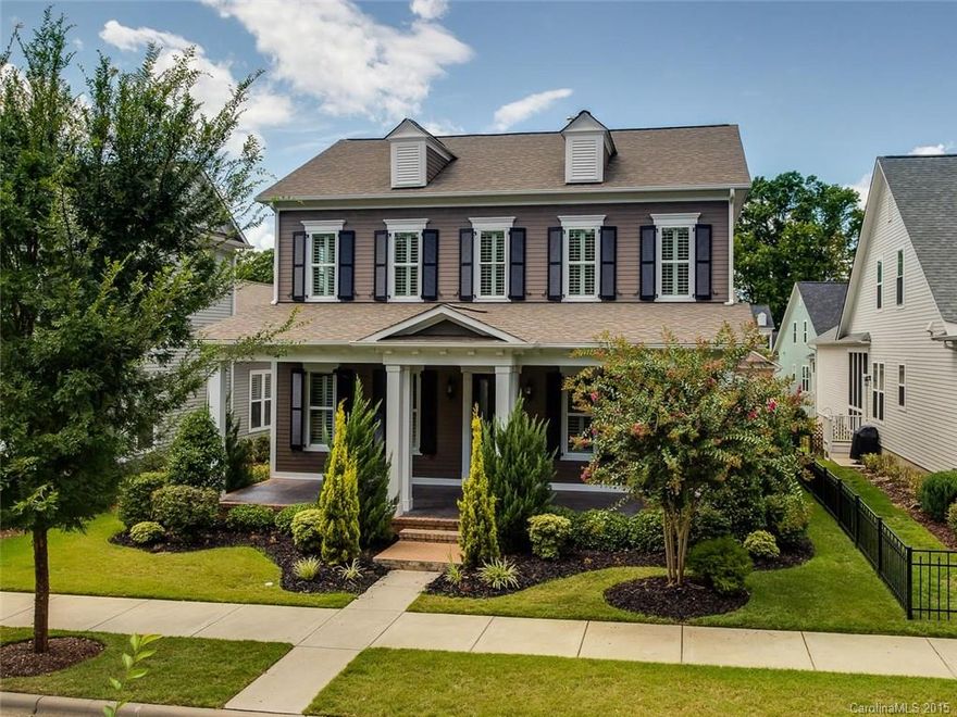 Lovely Transitional Home with Covered Rocking Chair Front Porch and Mature Landscaping Featuring Open Kitchen/Great Room, Sunroom and Master Bedroom on Main Level – Shows Beautifully! 10 Ft. Ceilings on Main, Wood Floors, Lovely Molding Detail and Neutral Colors.  Kitchen with Custom White Cabinetry, Oversized Center Island w/Breakfast Bar, Granite Countertops, and Stainless Steel Appliances with Gas Cooktop. Excellent Walk-In Storage.  Don’t Miss This Beautiful Home!