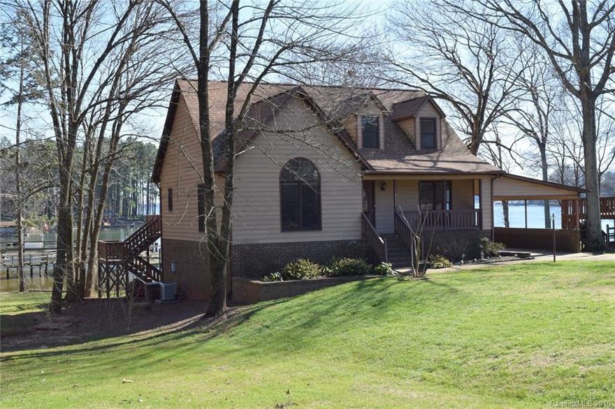 You have over 3000 square feet in a very functional floor plan, built in 1989, cedar siding w/carport & right on the water. Main floor master,2 bdrms up & 2 bdrms on the lower level. Kitchen has great storage,vaulted ceilings,sky lights;dining room w/wood flrs & living room features patio doors out to a great deck & that wonderful view. Downstairs has a 14x40 party room w/wet bar. Close to 100 ft of shoreline, complete with rip-rap, dock, floating pier & covered boat slip. Just off main channel
