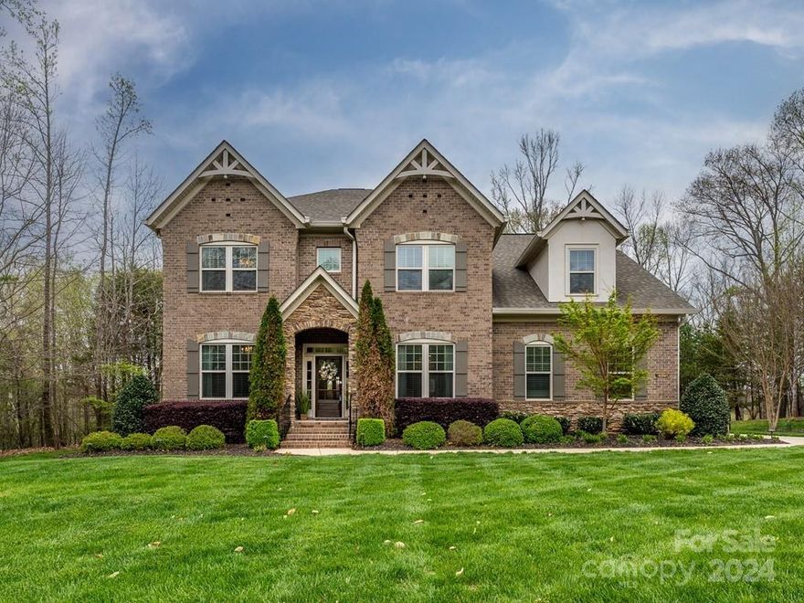 This is the home that you have been waiting for. Located in Farrington, a gated enclave of luxury homes only minutes from Ballantyne & within just a few miles of 77 and 485.   Absolutely move in ready w/a backyard & pool design that will make you feel like you are on vacation every day.  This home is beautifully situated on 1.25 acres w/a gorgeous, flat lot that is wooded in the rear for complete privacy. Please see full list of upgrades in the MLS attachment.  This home boasts site finished hardwoods on the main level, open floorplan, home office, formal dining, butlers pantry, large family room w/coffered ceilings, gorgeous, large chef's kitchen & a guest bedroom & bath on the main.  Four additional bedrooms, including the Primary bedroom & a large bonus room completes the upper level.  The expansive rear yard is fenced and has a fabulous pool and spa, gorgeous stonework, travertine decking, built-in gas grill, refrigerator, big green egg and an outdoor fireplace with a gas starter.