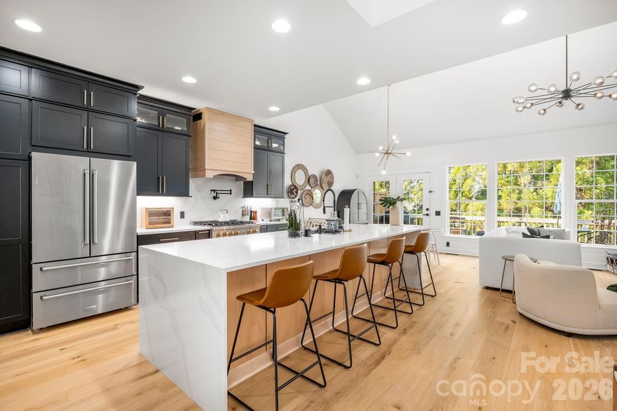 END UNIT! Welcome to luxury living in the heart of Ballantyne. This beautiful end-unit full brick townhome has been completely renovated with high-end, modern finishes throughout. Step inside to a bright foyer and an open, inviting floor plan designed for both everyday living and entertaining. New deck installed in 2025. In the basement, two additional flex rooms that can be used as guest rooms as well as plumbing for a FULL BATHROOM, shower, water, and drainage. The fully renovated kitchen features brand new appliances including a double wall oven and flows seamlessly into the spacious living and dining areas. Throughout the home you’ll find new hardwood floors, fresh interior paint, upgraded LED lighting, and stylish modern fixtures that elevate every space. The primary suite on the main level offers a private retreat with a fully renovated luxury bathroom, and all bathrooms throughout the home have been thoughtfully updated with modern finishes and built-in closets. Upstairs features a versatile loft, office space, and two additional bedrooms, offering flexibility for work-from-home or guest accommodations. The basement provides exceptional additional living space, featuring new vinyl flooring, a recreation area, office space, gym, golf simulator or hobby rooms. Furniture is negotiable. HVAC units replaced with new furnace in 2024. See attachment for upgrade list.