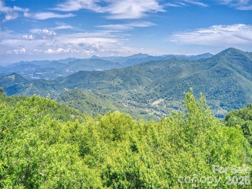 Great views with some clearing on this 2.06 acres homesite. Combined lots: 623 and 625. Located above Maggie Valley Country Club in the gated Smoky Mountain Retreat at Laurel Heights.