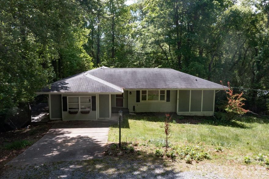 Convenient to both downtown Brevard and French Broad River access, this 3-bedroom, 2-bath home offers one-level living with an unfinished basement and a peaceful setting on approximately 0.65 acres. The main level features 1,676 square feet of heated living area with a functional floor plan that includes a spacious living room, dining area, kitchen, three bedrooms, and two full baths. Hardwood floors, abundant natural light, and a deck overlooking the surrounding trees add to the home’s appeal. The unfinished basement provides an additional 1,212 square feet, offering excellent storage, workshop potential, or future expansion possibilities. Conveniently located near Brevard with access to shopping, dining, schools, and outdoor recreation, this property presents a solid opportunity for buyers seeking space, usability, and a setting just outside town. Property is subject to court approval.