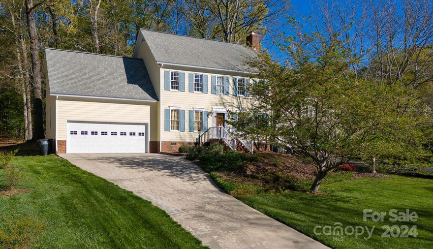 Welcome to this charming two-story home off India Hook Road complete with a home office room in the primary suite!  As you step in the front door, you'll quickly notice the beautiful, gleaming hardwood floors.  There is a separate dining room to the left and large great room with wood-burning fireplace to the right.  Double doors lead out back to the tranquil view of the wooded property.  Great kitchen has quartz counter tops, under-cabinet lighting, and an oversized breakfast nook with lots of windows.  A spacious primary suite boasts a large walk-in closet, large bathroom, and a bonus area that could be an office or fitness room.  Large walk-in closets in the other two bedrooms.  Bathrooms have quartz countertops and updated light fixtures. Upstairs carpet is one year old. Flowering trees and bushes in the Spring plus gutter guards.  Great location close to dining, shopping, Lake Wylie, and Interstate 77.  Sellers are providing a 2-10 home buyer warranty.