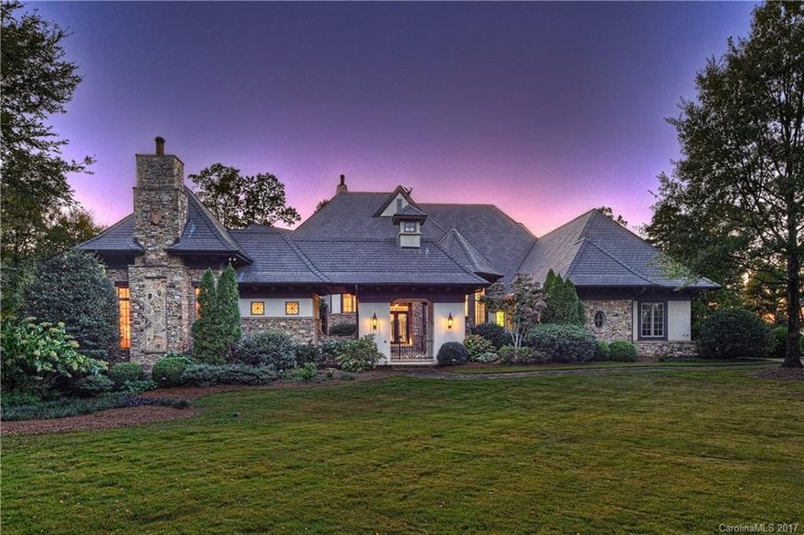 European inspired estate with gracious entry to courtyard. Luxury throughout with entertaining in mind. Expansive custom details. Generous windows to view the 1.39 acres on the private cove. Formal dining room and living room.  Master bedroom retreat. Theater room. Lake level features comfortable living room w/fireplace, full kitchen, game room, exercise room and full bath. In-ground pool, outdoor stone fireplace, kitchen & terraces. Separate guest cottage w/FPL. Pier with three jet ski docks.