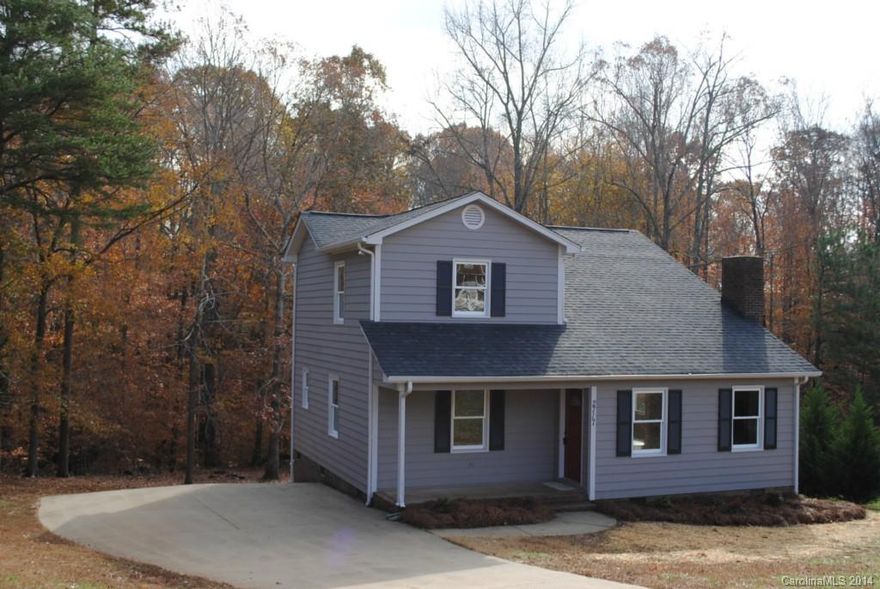 ADORABLE!  Hard to find 3BR w/ master on the main at this affordable price!  2 bedrooms and full bath up.  Two story vaulted great room with masonry FP, granite in kitchen and baths, bay window at dining, big deck out back overlooking wooded .64 acre lot.  Walkable neighborhood near horse farms.  Totally remodeled with new windows, new roof, new flooring, whole house interior AND EXTERIOR REPAINT.  Seriously cute!