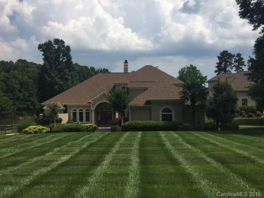 Waterfront living at it's best in this 2 story home in a cul de sac of a sought after community! Sit by your private pool & enjoy the views. Access Lake Norman easily from your private pier! Master suite on main level provides a view as well. Main level also features an office, 2 family rooms & another private bedroom! Head upstairs to the media room for more entertainment.