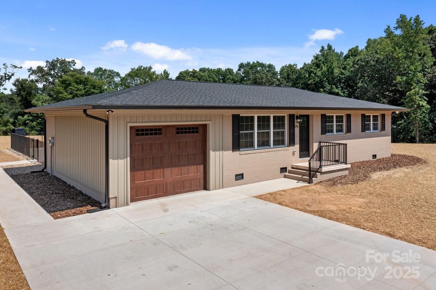 Don't miss this beautifully renovated brick ranch on 3.597 acres with an in-ground pool! Taken down to the studs and rebuilt with all new systems and finishes: roof, HVAC, windows, electrical, plumbing, doors, sheetrock, trim, and crown molding. Formerly a 3BR/1BA, now redesigned as a 2BR/2BA with a spacious primary suite, walk-in closet, beautifully tiled showers, and loaded with cabinetry for all your essentials. Open floor plan features new LVP flooring, fresh paint, and a stunning kitchen with new cabinets, granite counters, tile backsplash, and stainless appliances. Both bathrooms are updated with custom tile and modern fixtures. Enjoy the new Trex deck overlooking your private pool, surrounded by a concrete patio. A new laundry room with cabinetry adds convenience and additional storage. Peaceful setting with room to roam—this home offers the feel of quality new construction with the charm of an established home. Move-in ready and truly one of a kind!