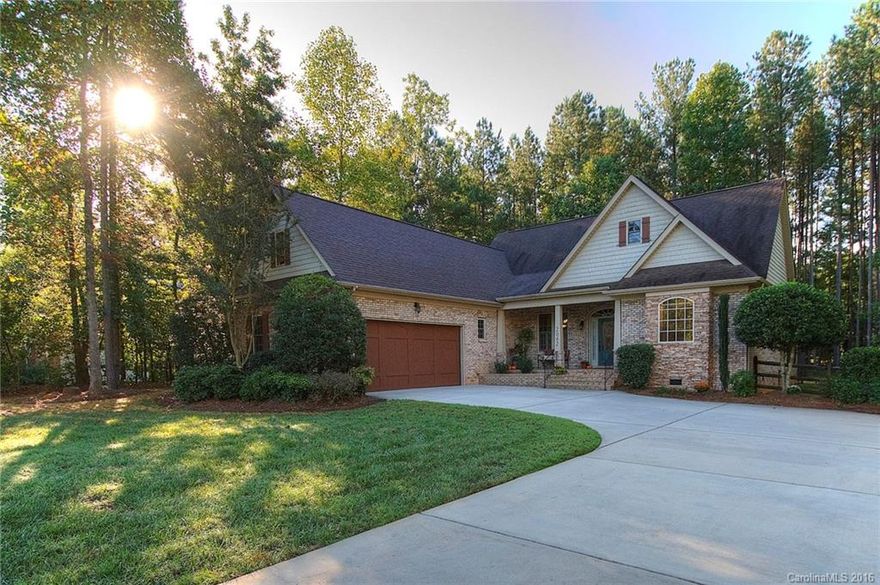 Enjoy cool evenings on the cozy screened porch of this craftsman style all-brick ranch home. Split bedroom plan with 4th bedr/bonus above the garage. Beautiful granite & custom cabinetry in kitchen, gas range, formal dining. Open floor plan for easy entertaining and family interaction.  Lovely wood floors throughout the home!  Wooded lot with private fenced yard, natural gas generator and hot tub conveys.  Just a mile from the public boat ramp. Excellent Clover schools and low county taxes.