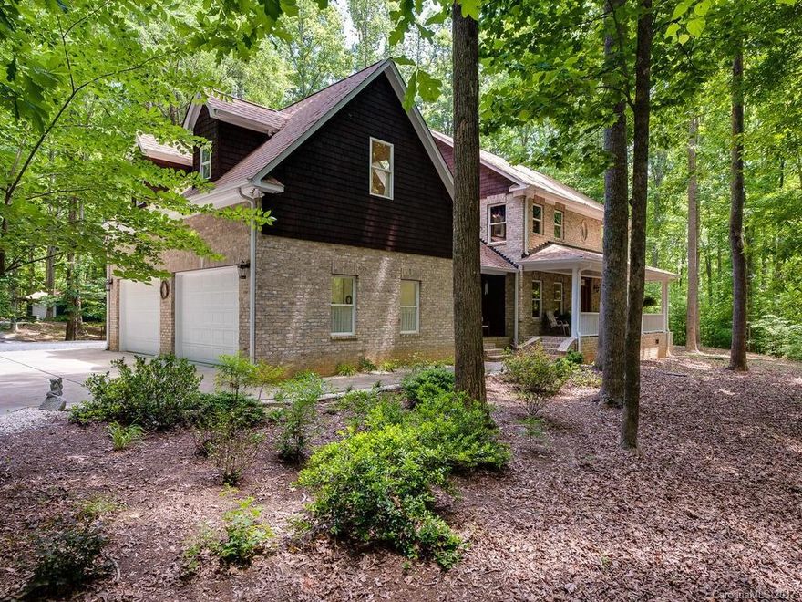 Meticulously maintained home with all the upgrades you want on 5 acres of wooded land in York County SC.  This beautiful home has large front porch with nice columns and stone flooring and rear terrace with fireplace.  Inside you will find large chef's kitchen, laundry room w/sink, nice sized rooms, hardwood floors, woodburning fireplaces and much more.  Upstairs has 3 or 4 BR's, with the MBR having a tray ceiling and fireplace.  Attached 4- car gar., detached 2-car carport, seperate workshop.