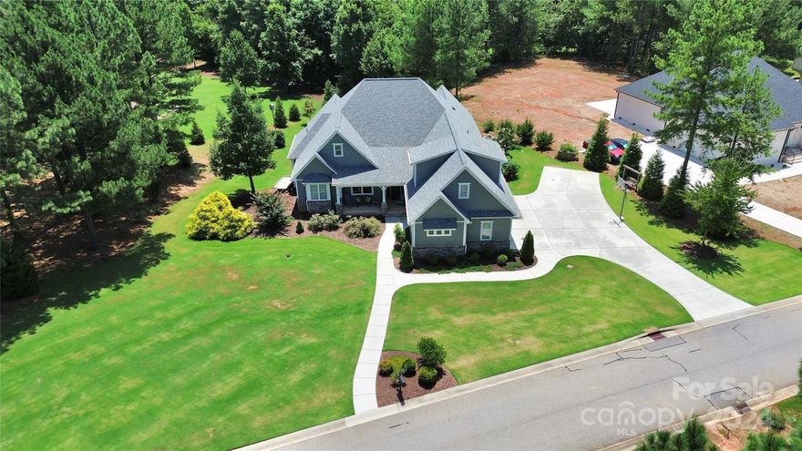 "Absolutely stunning home in Killian Crossing!  Come see this standout property in the neighborhood.  Builders personal home with meticulous attention to detail, main living area on main level including primary bedroom. Home sits on a gorgeous corner lot.  Features include amenities above the three-car garage---living room, bedroom, and bathroom. This is a must-see!"   2 gas fireplaces.   Shed for storing yard equipment etc.