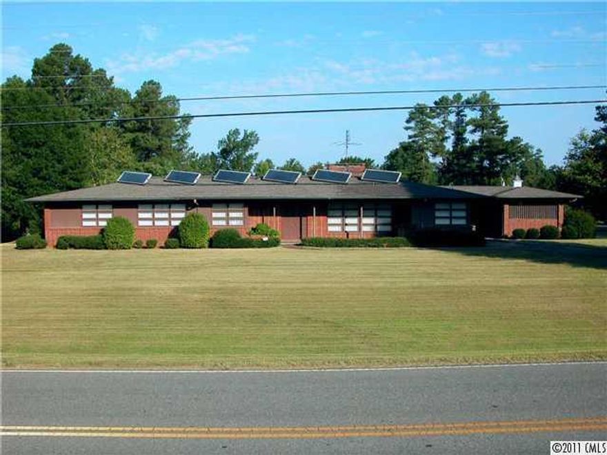 Spacious, Quality construction, Solar effiecent, well-maintained, AND Beautiful - are a few of the special characteristics of this house!  Could work for 2 master bedroom requirements. Beautiful hardwood & tile permanant flooring, 2 fireplaces, 4-5 bedrooms, large closets, ceramic baths in excellent condition. Glass surrounds every room to bring the outdoors in! Carpt. 1.7 acre corner lot with joining 1.8ac available. Additional 11 acres (3 lots) across Burns street for $25,500 with house sale.