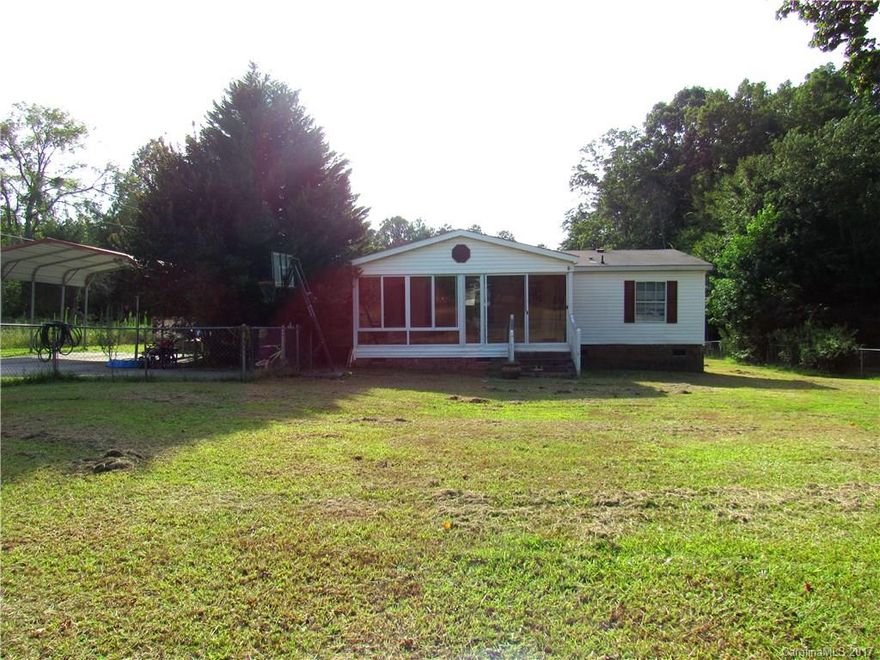 Well maintained mobile home on an acre.  You will love the open kitchen to the living area!  3 bedrooms and 2 full baths, wood burning fireplace and fenced in yard.  Very nice enclosed porch/sunroom area with sliding glass windows.