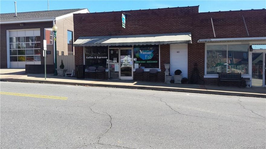 GREAT IN TOWN LOCATION ACROSS FROM MARS HILL UNIVERSITY'S NEW SCHOOL OF BUSINESS & SOUTHERN APPALACHIAN REPERTORY THEATER, WALKABLE FROM ALL STUDENT CAMPUS HOUSING, TWO DOORS FROM RECENTLY REOPENED MOVIE THEATER/PERFORMANCE SPACE/RADIO STATION.  SPACE IS OPEN WITH RESTROOM  AND REAR VIEWS OF MOUNTAINS. COFFEE SHOP/ICE CREAM/DELI, RETAIL, OFFICE ARE JUST SOME OF THE POTENTIAL USES.  STREET LEVEL APPOX 2000 SF LOWER LEVEL APPOX 1000 SF. MONTHLY LEASE RATE OF $1600 IS GROSS, UTILITIES PD BY TENANT.