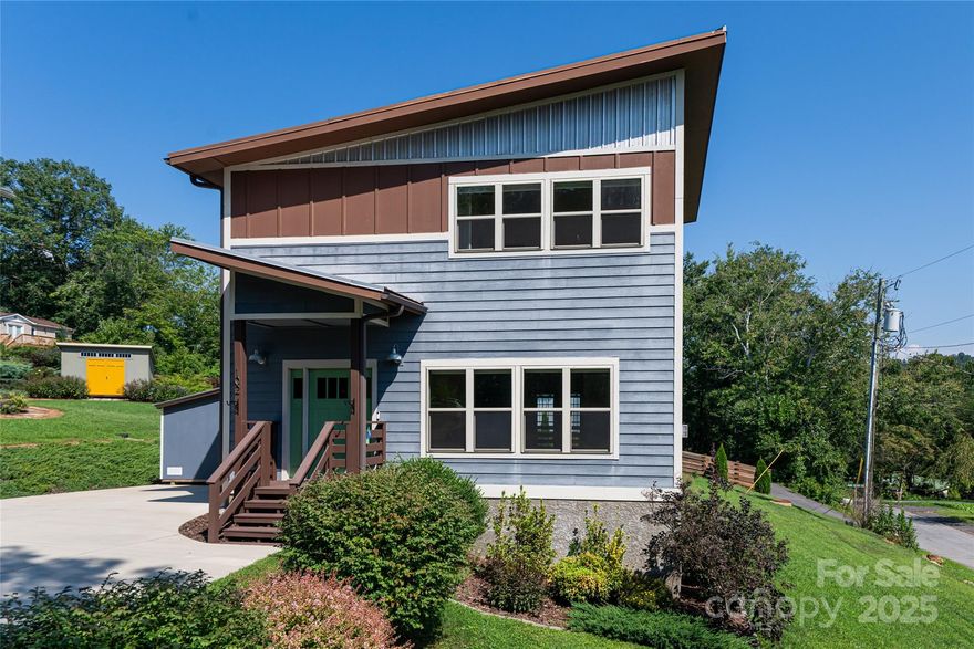This beautifully crafted home offers the perfect blend of comfort, style, and mountain charm—just 10 minutes from downtown Asheville and close to West Asheville, Woodfin, and the French Broad River. Situated in a quiet Woodfin neighborhood this move-in-ready home has an open floor plan is filled with natural light, antique reclaimed heart pine floors, wooden accents and a cozy gas fireplace. The kitchen includes a center island, granite countertops and a walk-in pantry. The kitchen flows seamlessly into the living and dining areas - creating the ideal space for everyday living and entertaining. The living room features custom built-ins and large windows. Enjoy mountain views from the primary suite, complete with double closets, double vanities, and a walk-in shower. Situated on a flat corner lot, this home's outdoor space is ideal for gardening, entertaining, or simply relaxing on the back deck. For more outdoor adventure the upcoming greenways and new River Parks nearby provide a connection to a large greenway system. Additional storage shed will convey the home. Enjoy easy access to I-26, Biltmore Estate, UNC Asheville, and all the best shopping, dining, and hiking that make Western North Carolina so desirable.