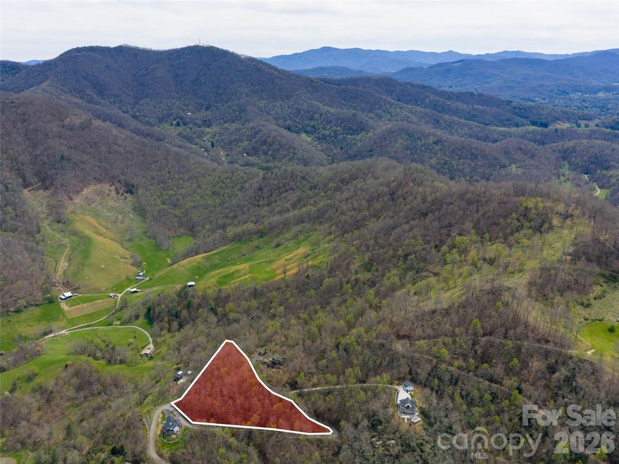 Located in desirable Winfield estates surrounded by beautiful long range views and homes with year round paved access in the peaceful upper Crabtree community with underground electric installed. This level to sloping lot has a build-able ridge to situate your new home and trim the view you desire. Well and septic needed.