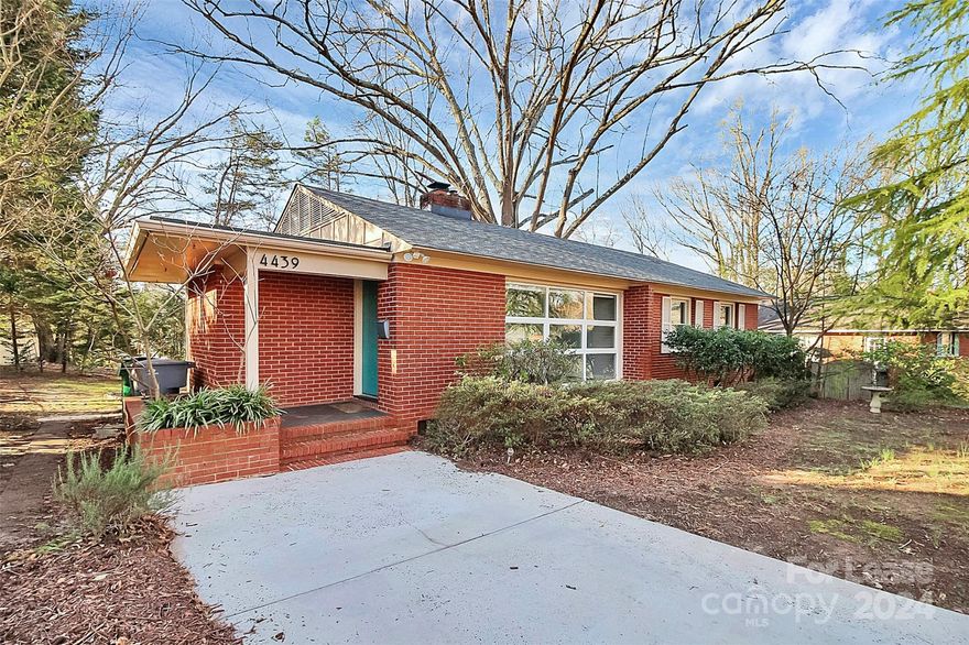 Come see this charming 3 bed/2 bath home nestled in the desirable Collins Park neighborhood! Step inside + be greeted by an abundance of natural light streaming through the expansive front windows, creating a warm + inviting atmosphere. The spacious living room boasts a cozy wood-burning fireplace, ideal for relaxing evenings with loved ones. Admire the timeless beauty of the original hardwood floors that flow seamlessly throughout the home, adding character + charm to every room. The kitchen features SS appliances, elegant butcher block countertops + ample storage space. Out back, you'll enjoy summer bbq's + quiet evenings under the stars in the massive backyard oasis. Your 3 bedrooms are tucked away on the right side of the home. The primary retreat also features an en-suite bathroom for privacy, while the two secondary bedrooms share another full bath. This home is conveniently located just minutes from the light rail, I-77, South End + Park Road Shopping Center!