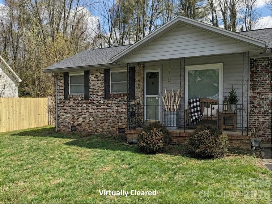 THIS HOME IS IN EXCELLENT CONDITION! Ideally located in the heart of Etowah, NC, this property offers exceptional convenience just minutes from Etowah Park, grocery stores, restaurants, golf courses, schools, and shopping. Perfectly positioned between Hendersonville and Brevard, you’ll enjoy easy access to both communities while still benefiting from a peaceful neighborhood setting. Inside, the home features a well-designed floor plan with a spacious living room that’s perfect for relaxing or entertaining. The beautiful, nicely sized kitchen provides ample space for cooking and gathering, while select hardwood floors add warmth, charm, and character throughout the home. Natural light enhances the inviting atmosphere, making the space feel comfortable and welcoming. Situated on a level half-acre lot, the property boasts a large backyard ideal for outdoor activities, gardening, or simply enjoying the outdoors. Additional features include an outside storage closet for extra convenience, along with a heat pump and central air conditioning system installed in 2017, providing efficient year-round comfort. A fantastic opportunity in a prime location—this home truly offers comfort, convenience, and value, making it a great deal you won’t want to miss!