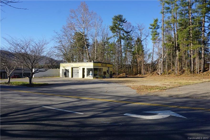 Located at the Corner of North Main Street and Henson/Leatherwood Streets with 306 feet of road frontage is this prime commercial .72 acre parcel. Former uses were a paint and body shop, car wash, and gas station. All storage tanks have been removed and soil samples taken. NC Environmental Quality has issued a clean bill of health for the property and property is ready for use. Letter attached.  Present building is being sold as is.