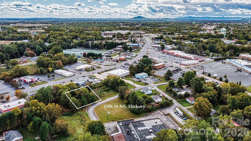 Excellent commercial development opportunity in the growing Northeast Hickory / Springs Road corridor. This 0.42-acre parcel on 12th Ave Place NE (adjacent to MLS # 4354922) offers an ideal location for a variety of development possibilities. Conveniently positioned near established businesses, restaurants, and retail along the Springs Road corridor, the property benefits from strong visibility and steady area traffic. With continued growth in Northeast Hickory, this site presents a prime opportunity for investors or developers looking to capitalize on a thriving commercial area.

Zoned C-2, the property allows for a wide range of potential uses providing an excellent opportunity for investors, developers, or business owners looking to establish a presence in a growing commercial area.

City water and sewer lines are located nearby; however, extension and tap fees will be required for connection. Buyers are encouraged to reference the City of Hickory Land Development Code for additional information regarding utility connections and development requirements.  Ideally located of Springs Road, with easy connectivity to I-40, Hwy 127 and more.